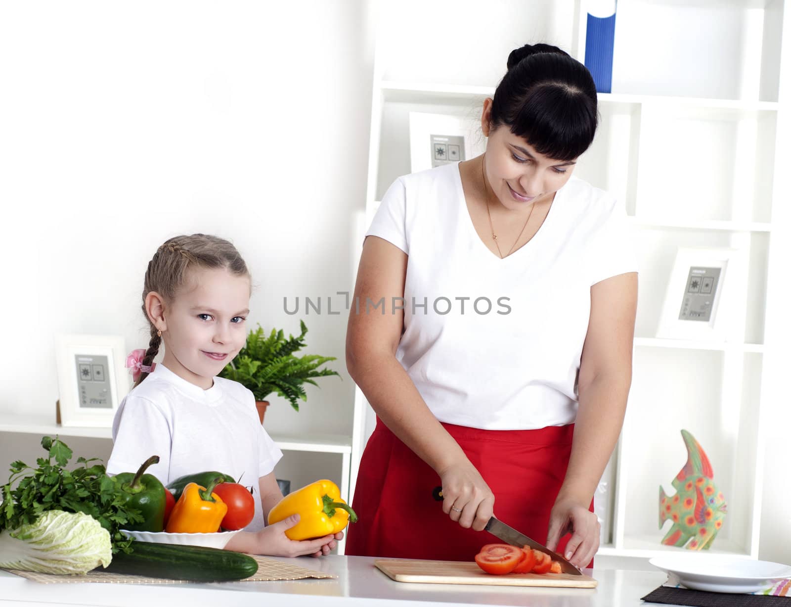 mom and daughter cooking together by adam121