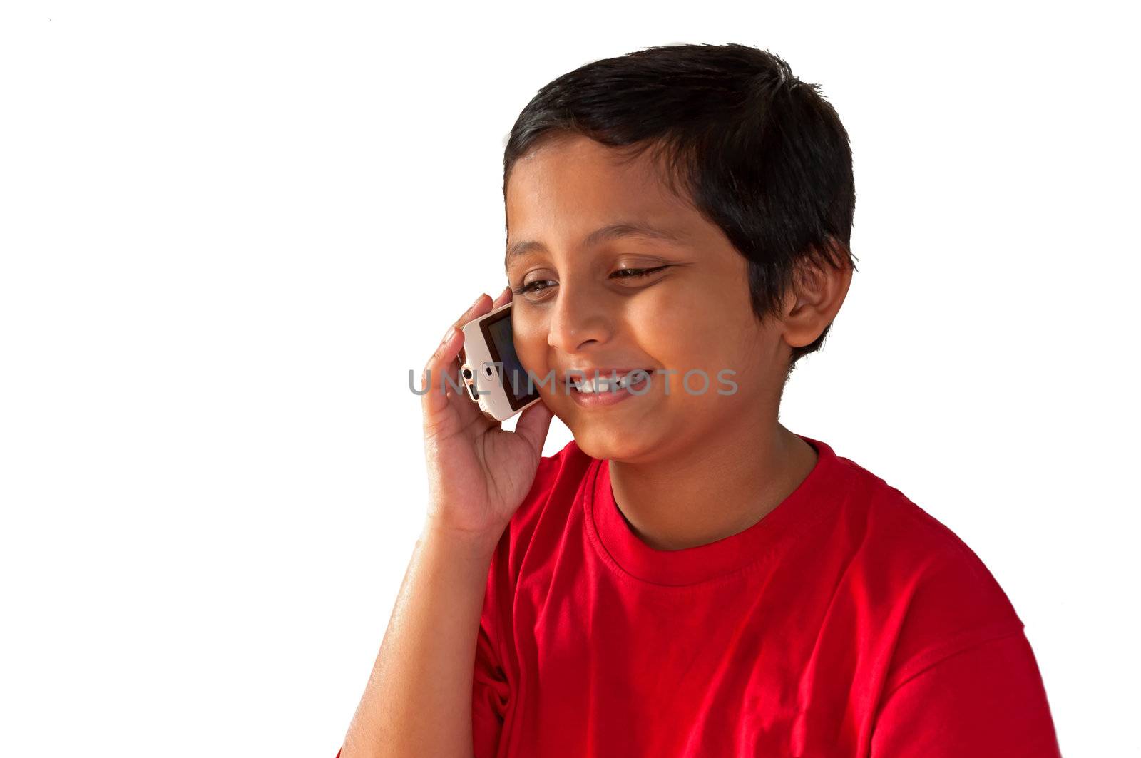 Asian, Indian, Bengali young boy talking on mobile phone, smiling, isolated,white background