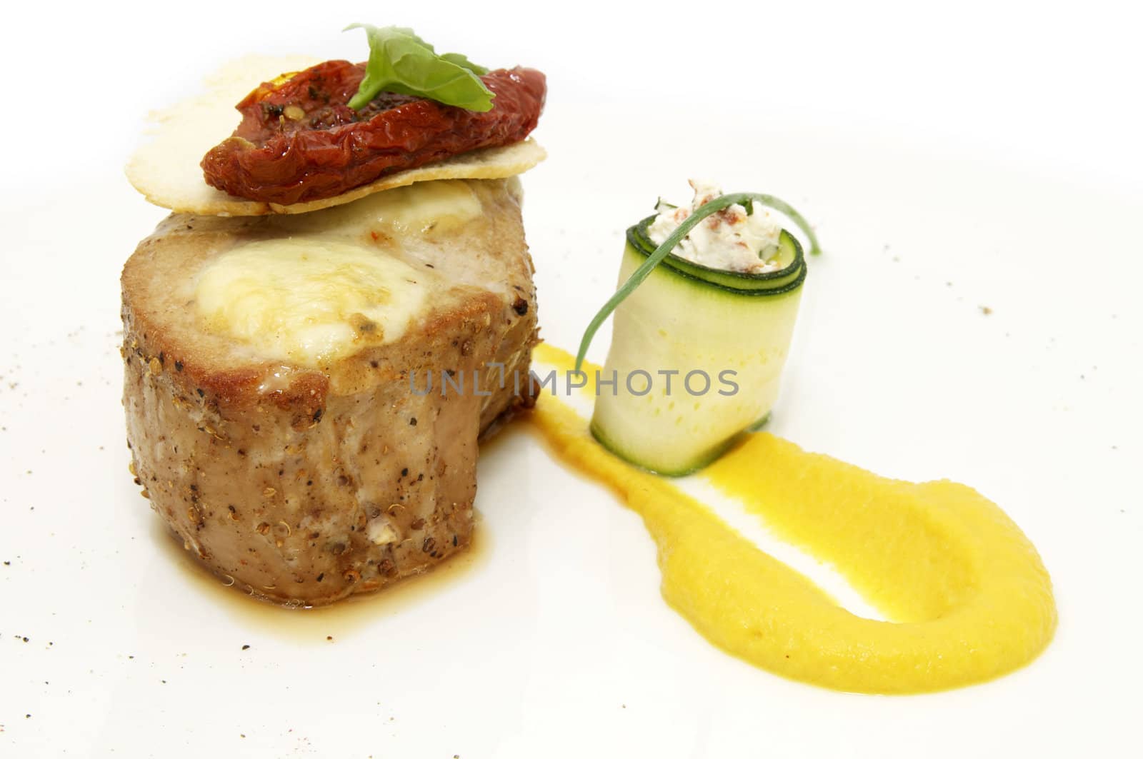 baked meat decoration of green sauce on a white background