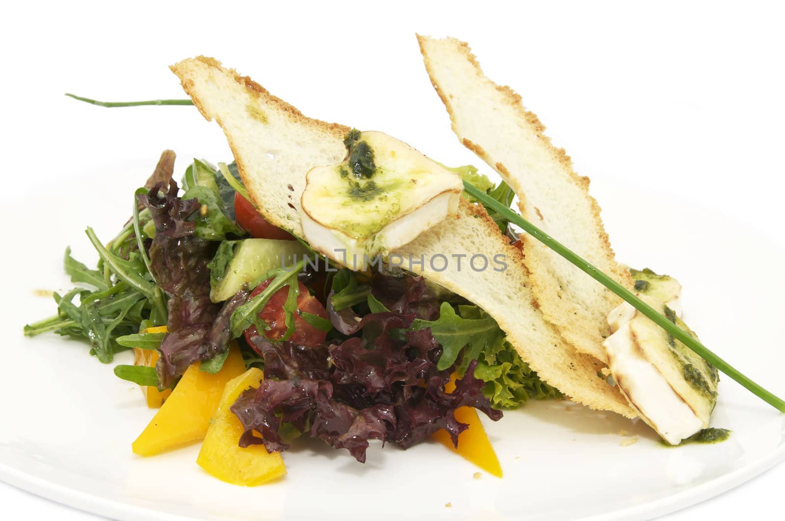 salad greens and cheese on a white background in the restaurant
