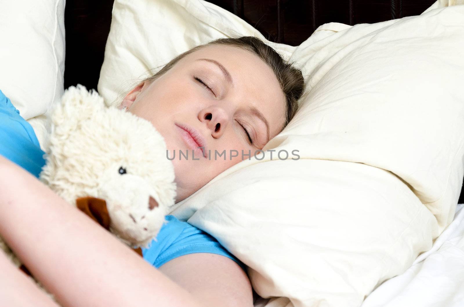 Young girl fell asleep with teddy bear