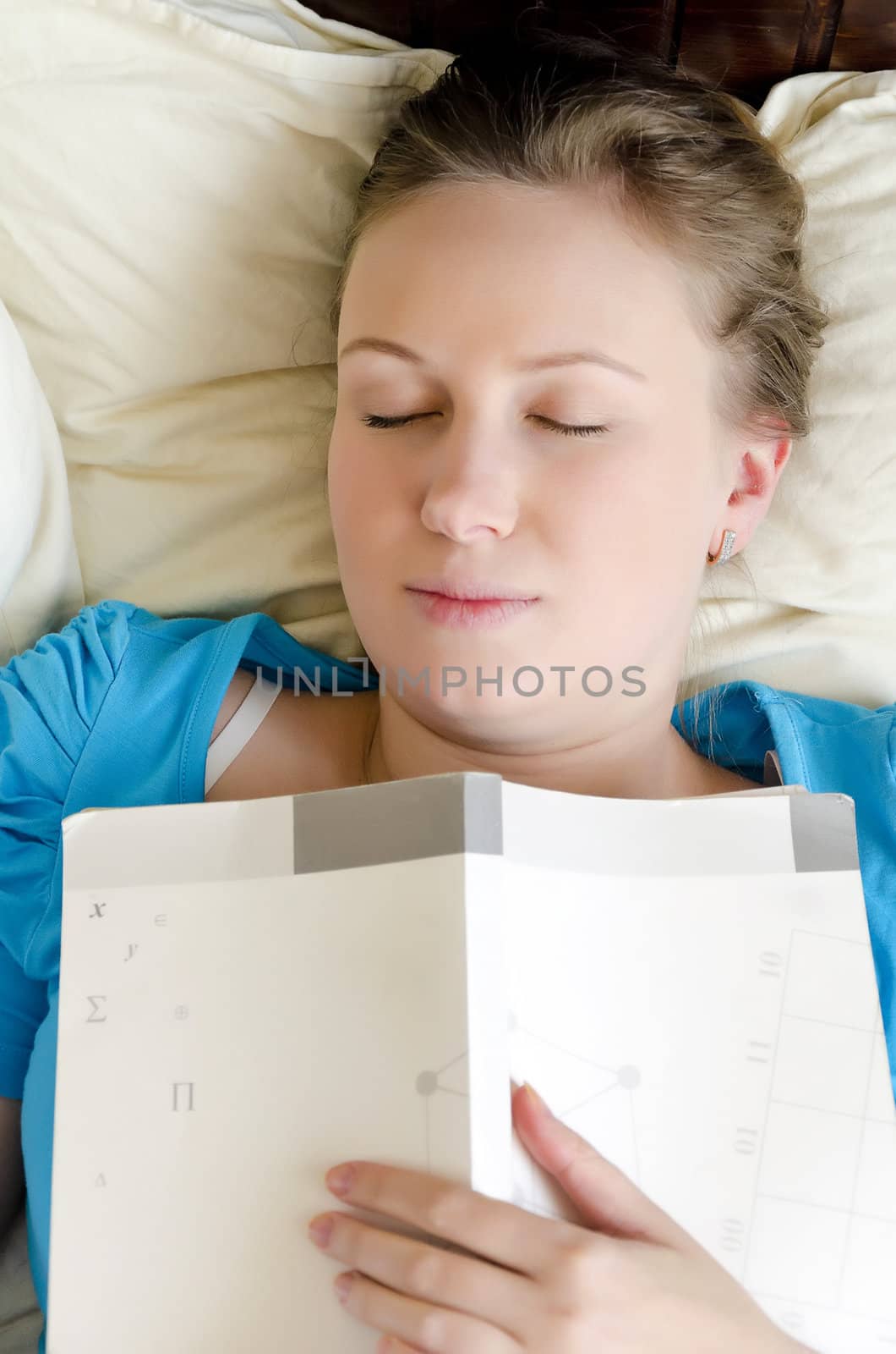 Young girl student was tired and fell asleep