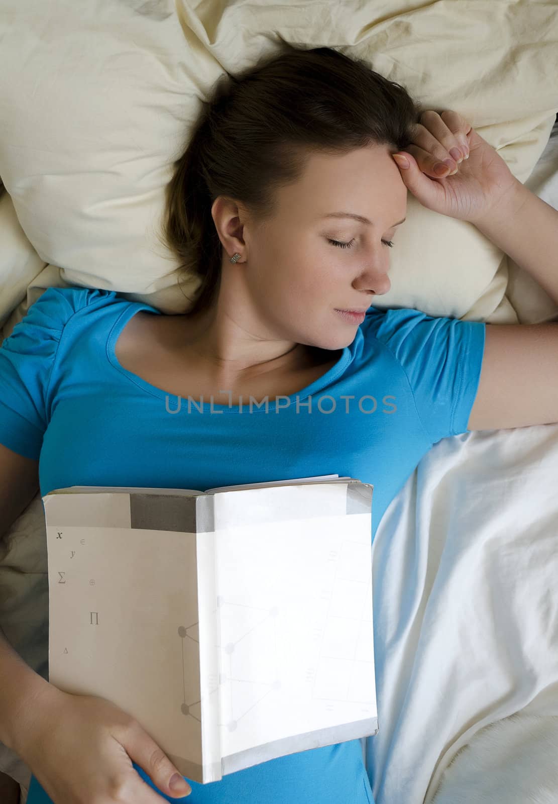 Young girl student was tired and fell asleep