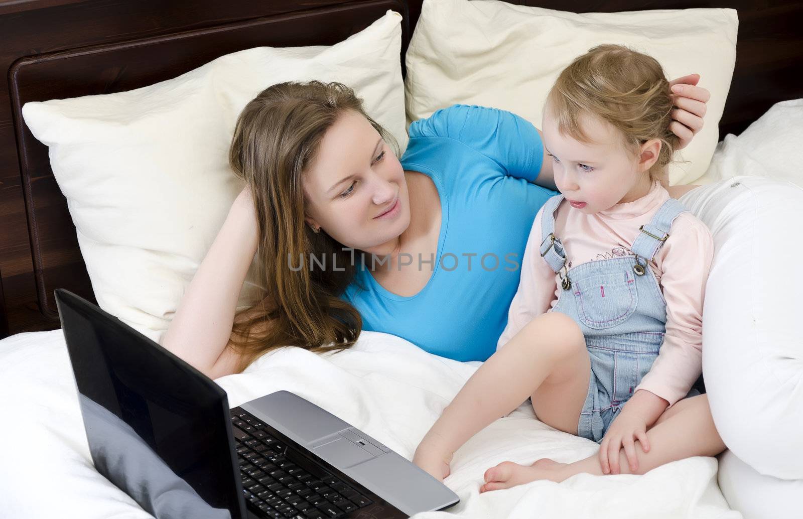 Happy family watching a cartoon on the laptop