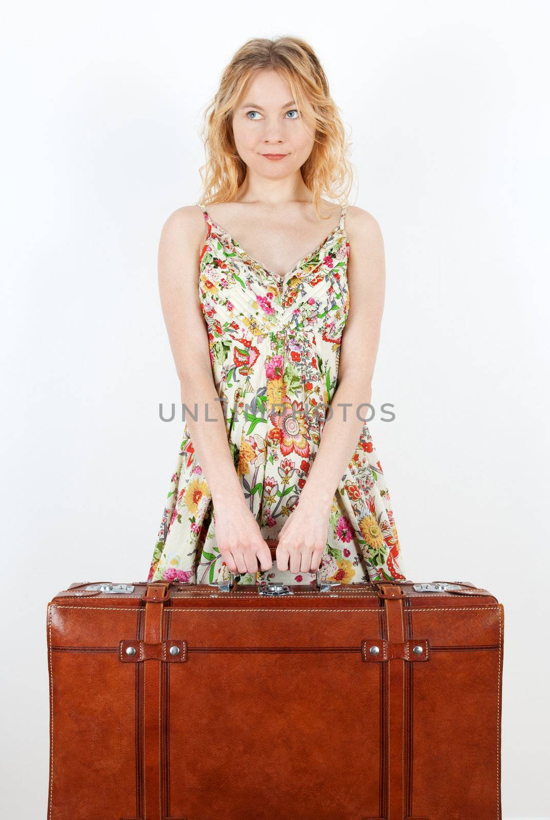 Girl with vintage suitcase anticipating travel by anikasalsera