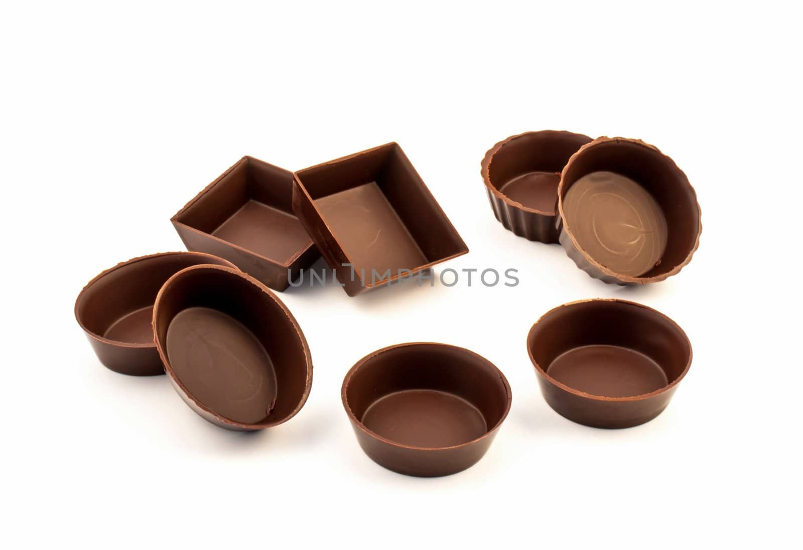 Chocolate edible molds pastry, isolated on white background