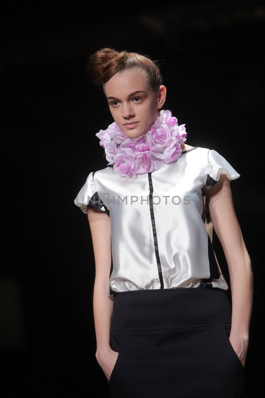 ZAGREB, CROATIA - MARCH 22: Fashion model wears clothes made by Image Haddad on "CRO A PORTER" show on March 22, 2012 in Zagreb, Croatia.