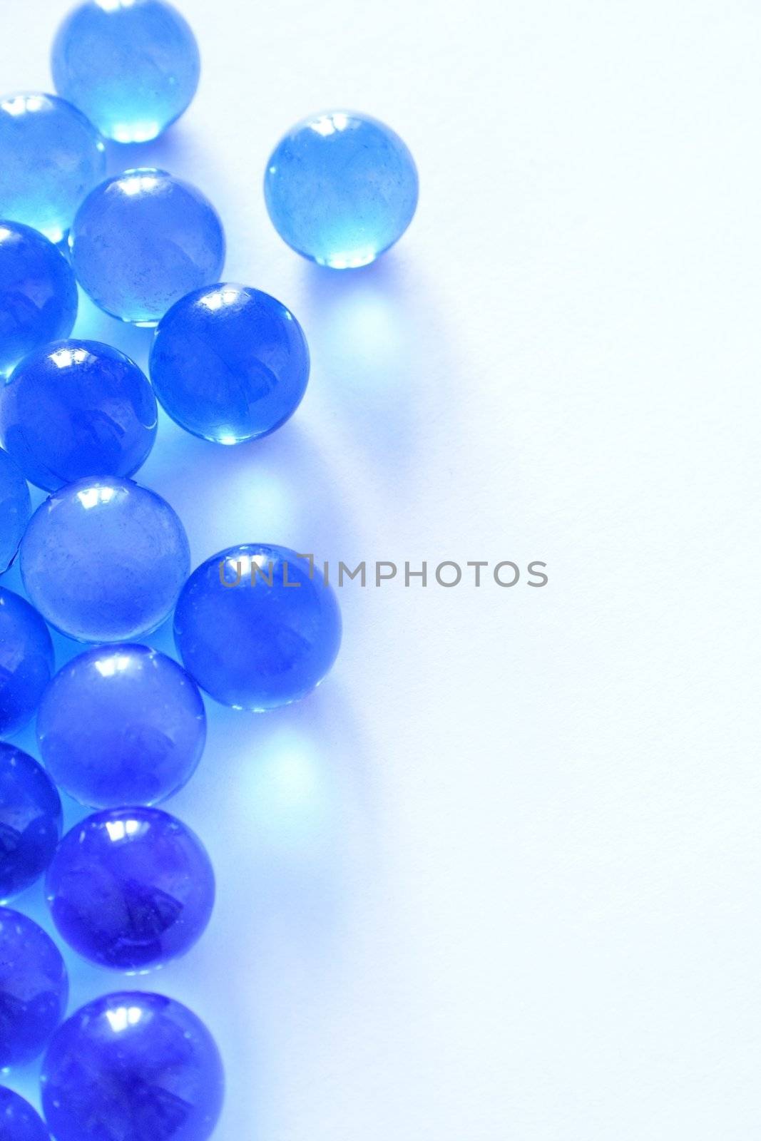 blue glass beads on a white background.