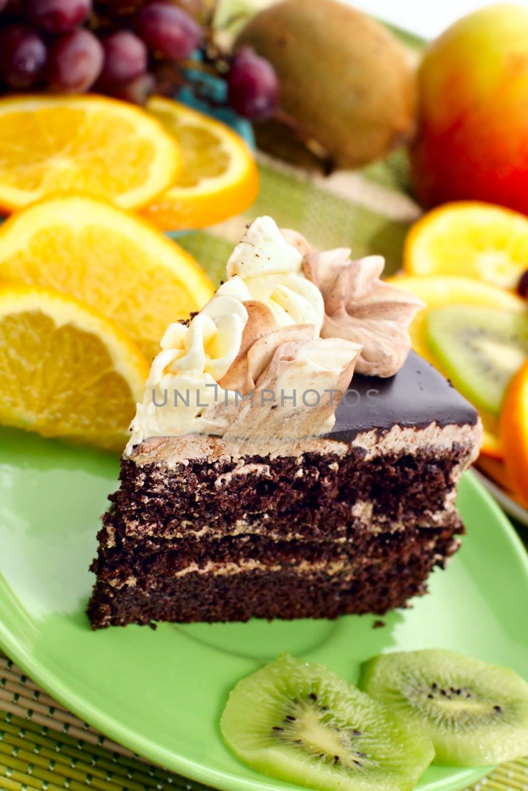 Birthday cake with cream with fruit in the background