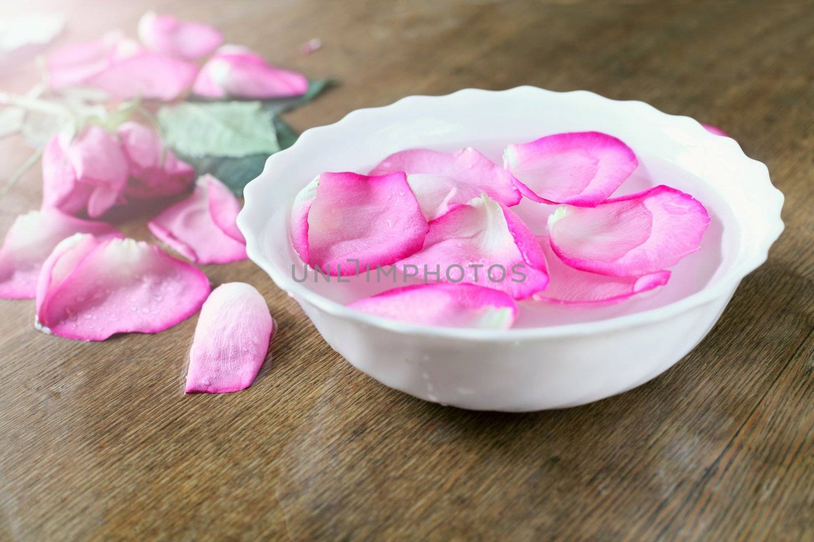 bowl with water and rose petals