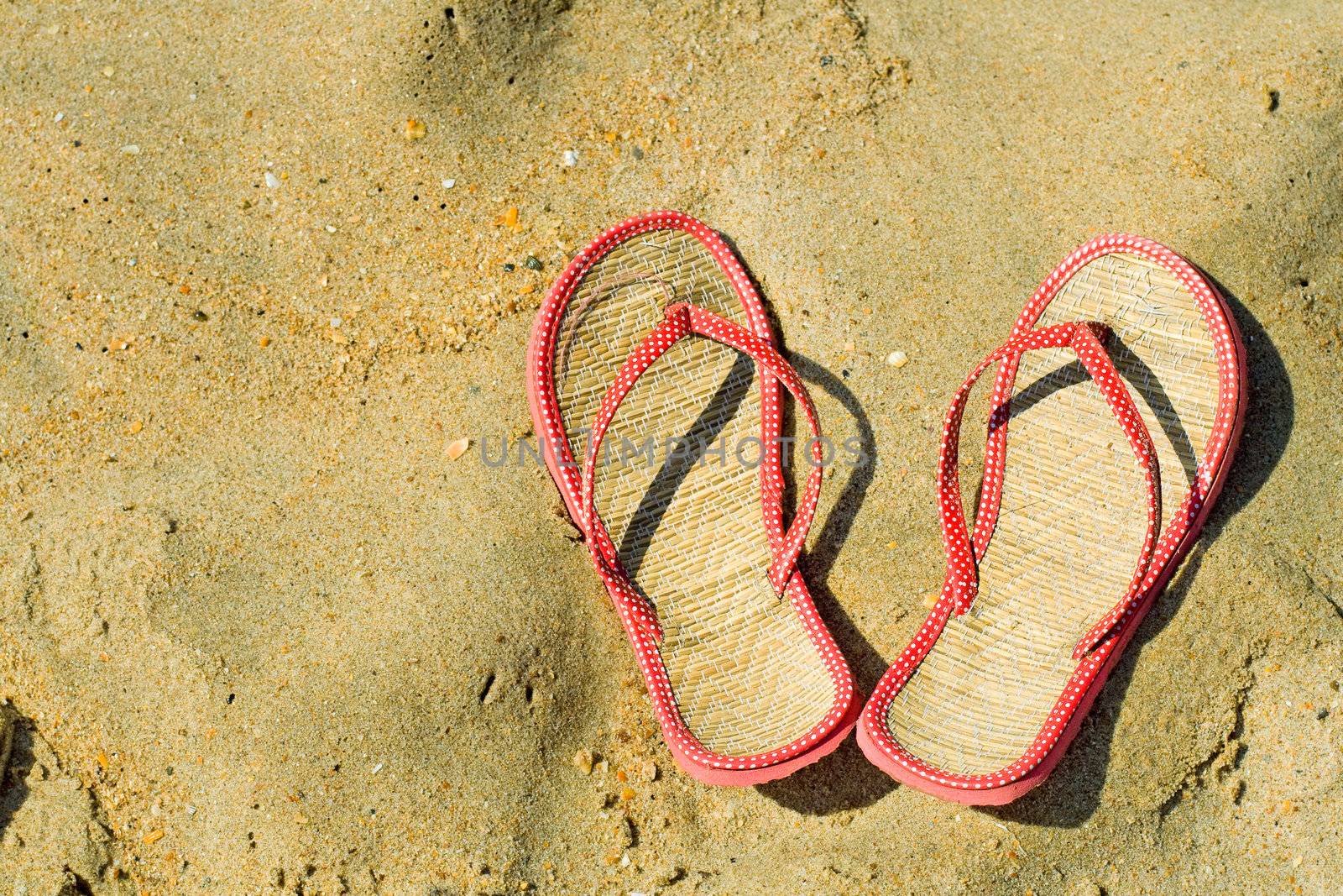 sneakers on a sandy beach