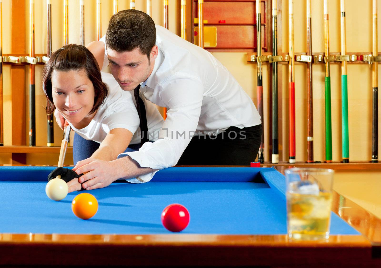 couple playing billiard expertise teacher and beautiful girl