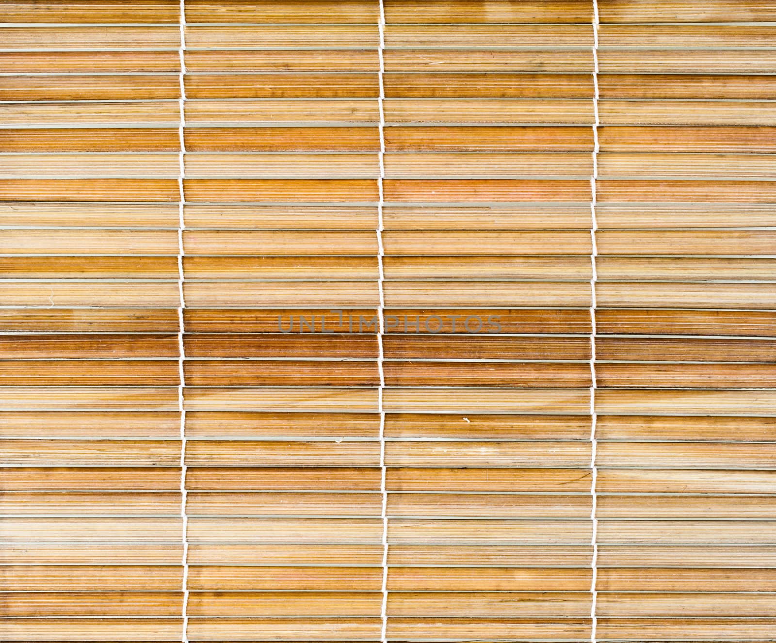 Bamboo sticks with thread uniting background