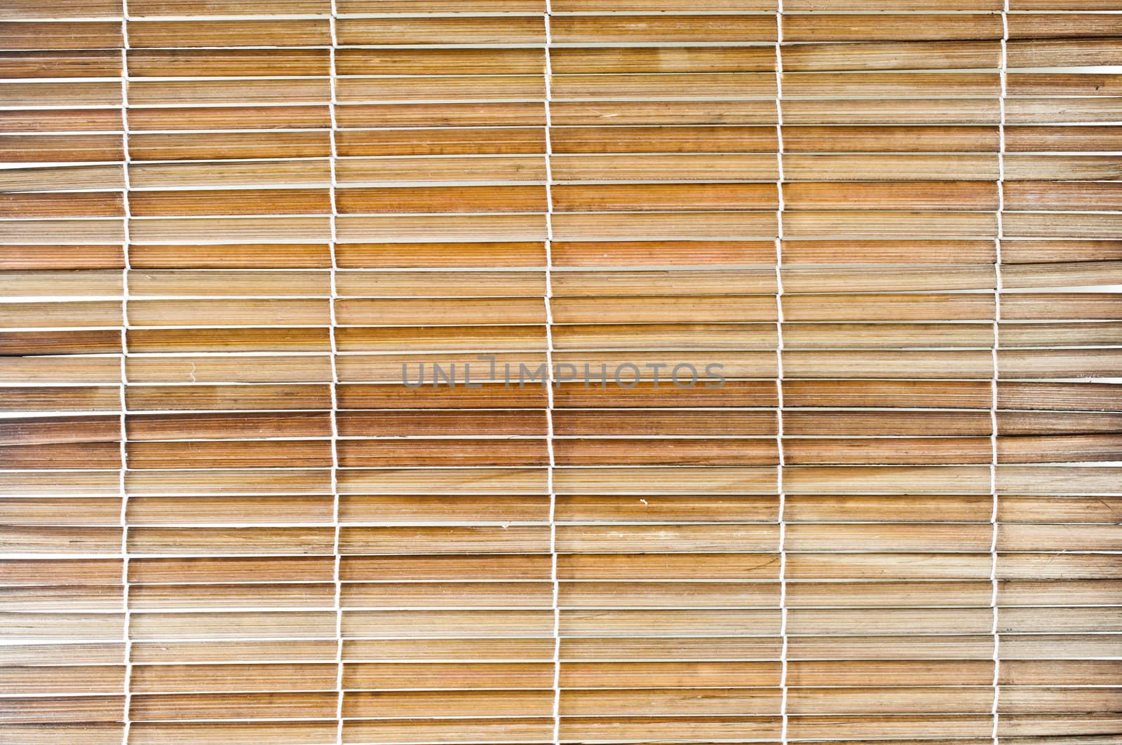 Bamboo sticks with thread uniting background