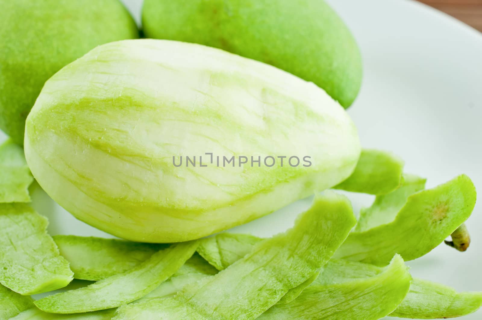 Mango fruit on white dish