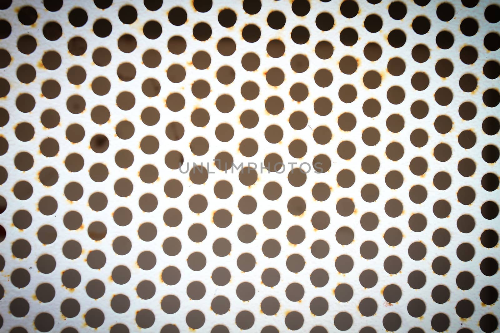 metal background with perforated holes