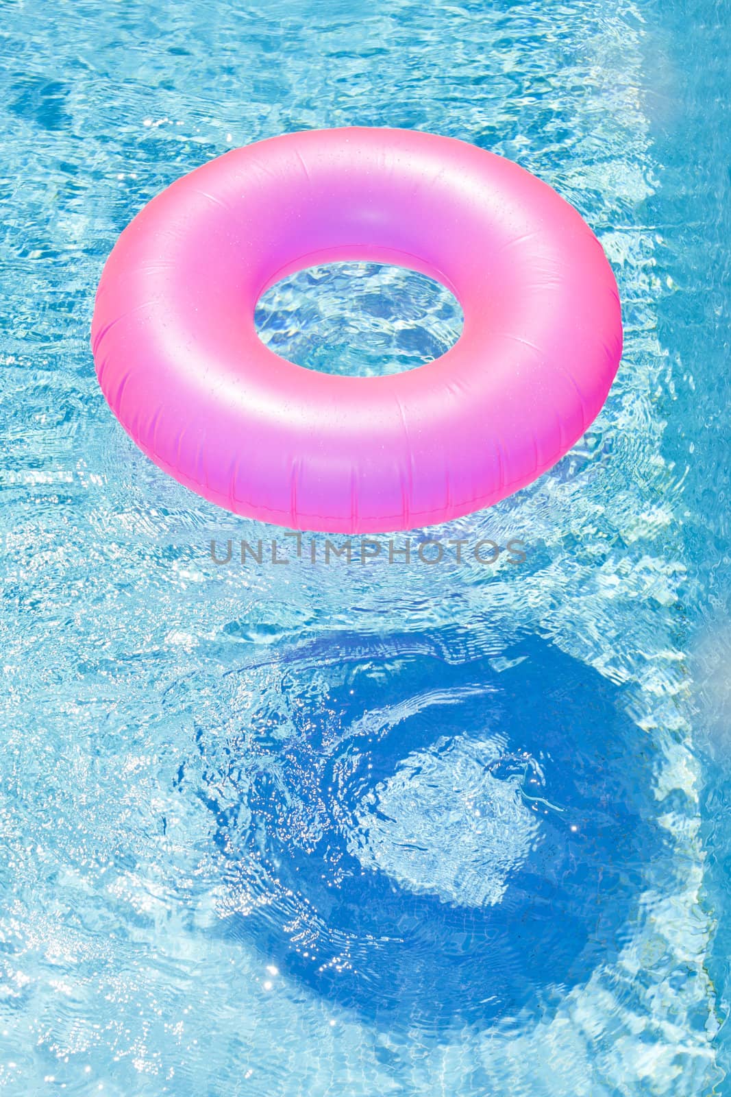 pink rubber ring in swimming pool