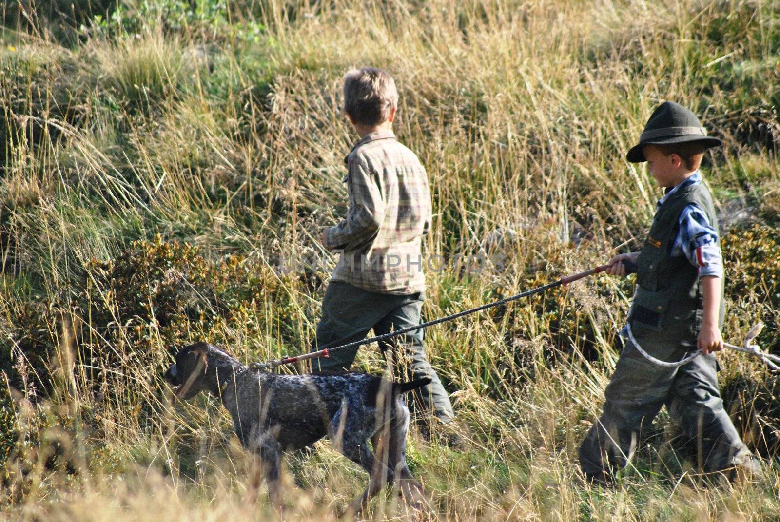 Two young hunter in the grass