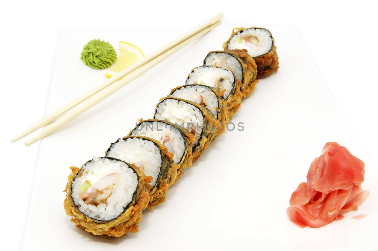 portion of the rolls and chopsticks on white background