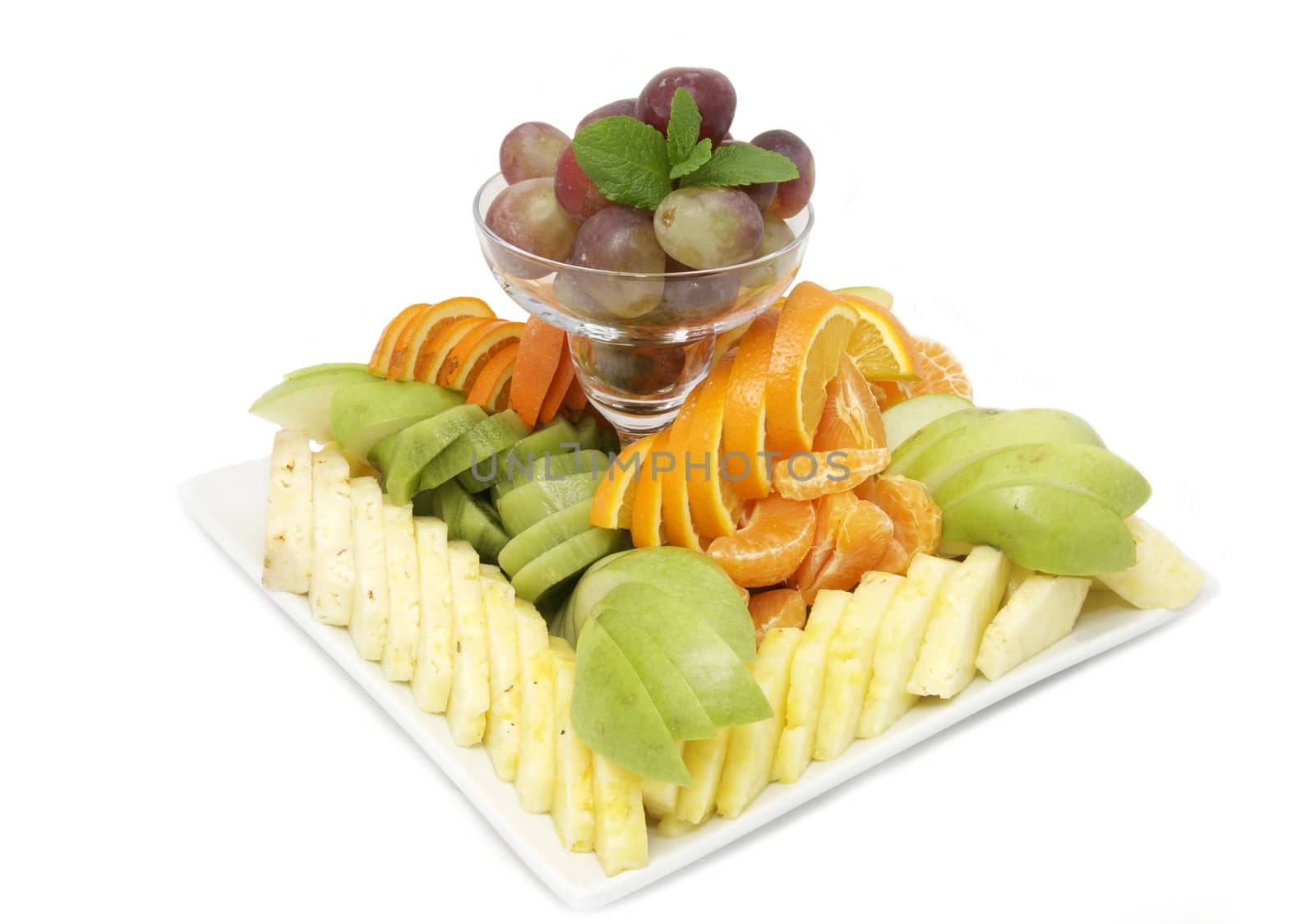 a large plate of fruit on a white background