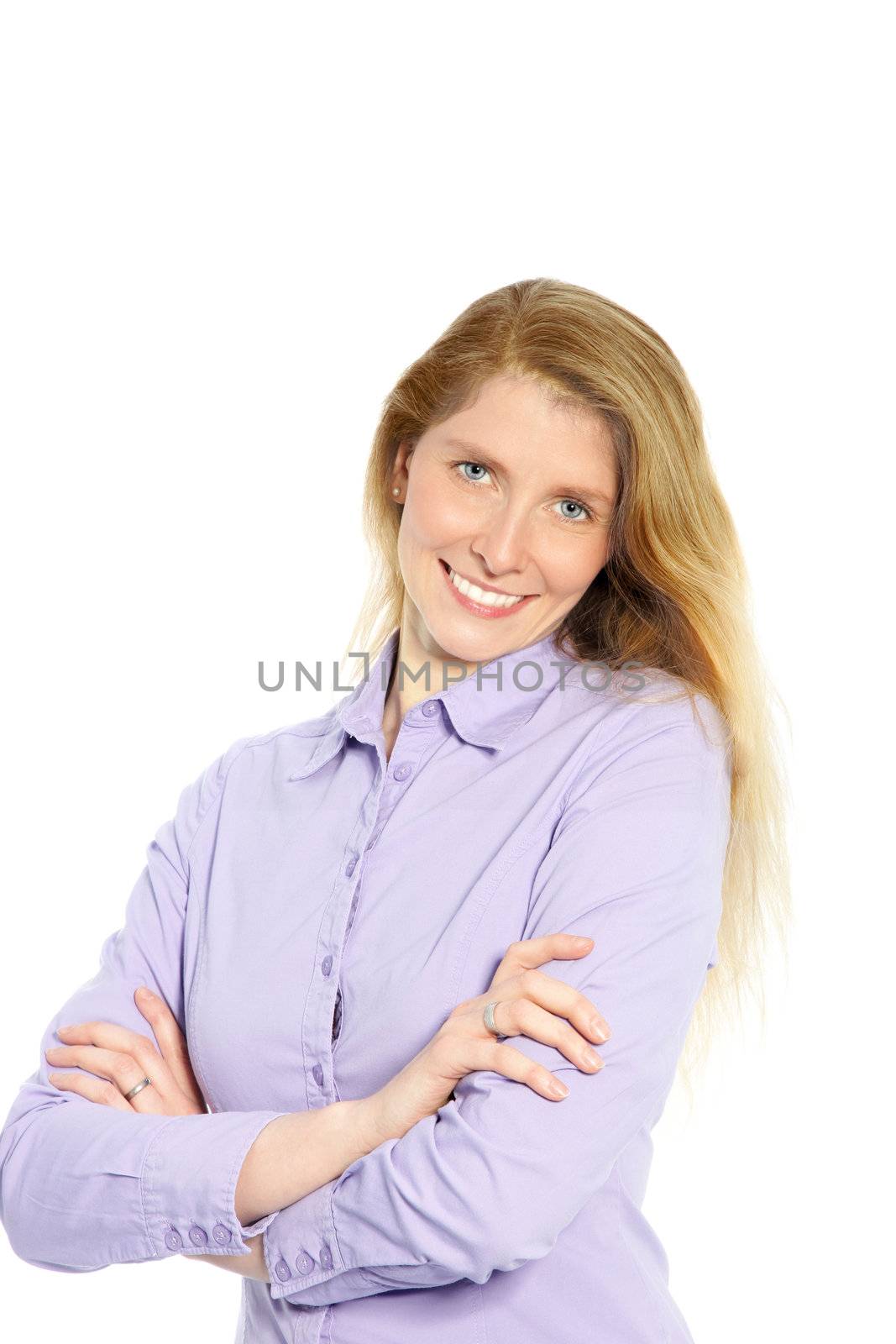 Portrait of an attractive caucasian woman with her arms folded smiling at the camera.