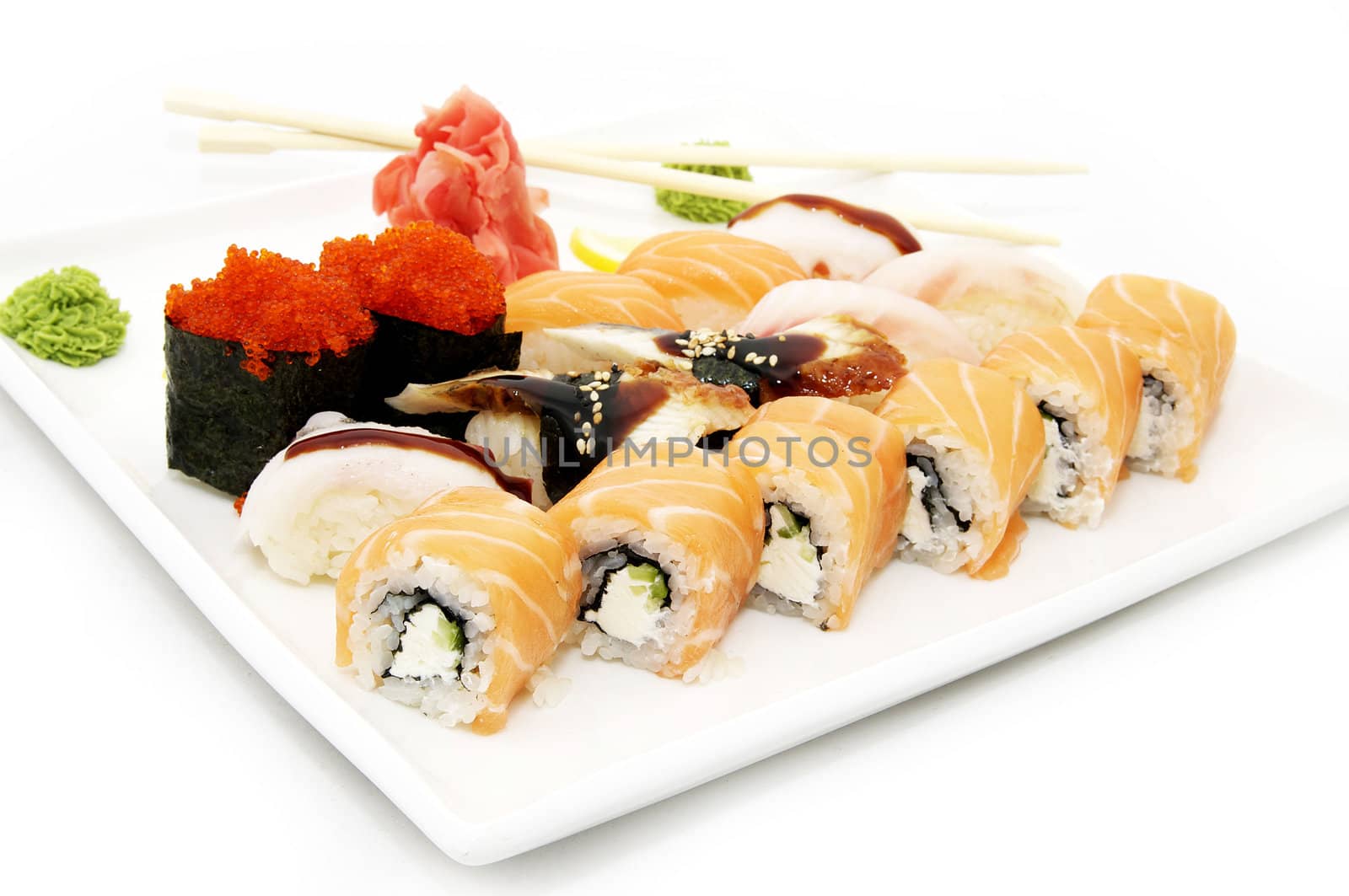 a large plate of Japanese sushi on white background