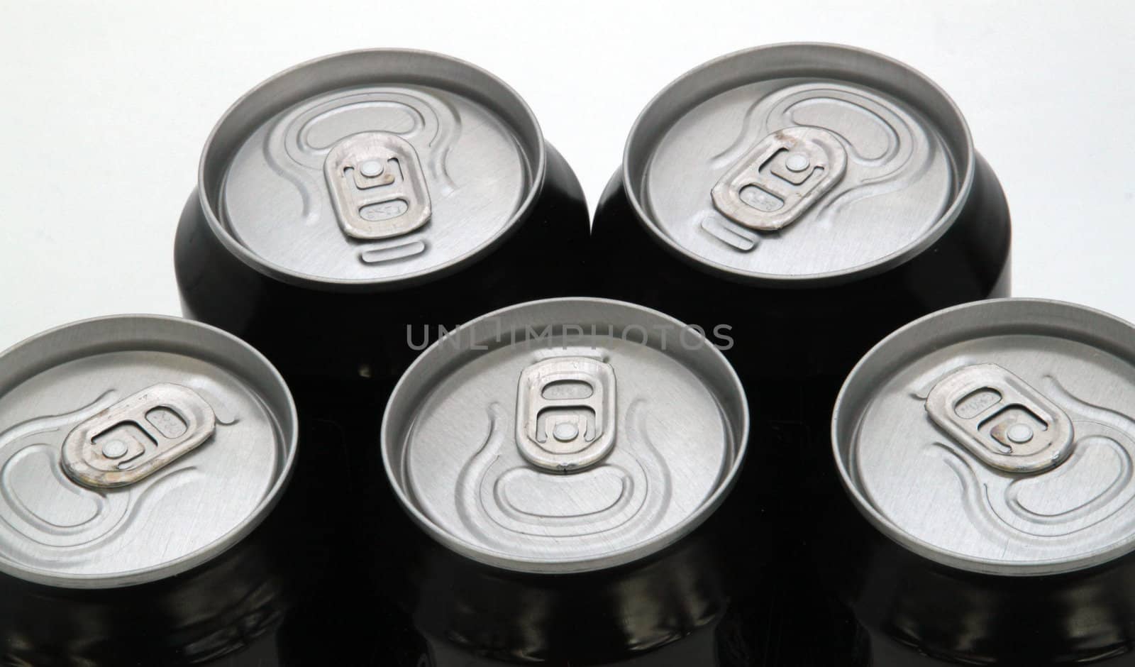 Tops of drink cans against a plain white background.