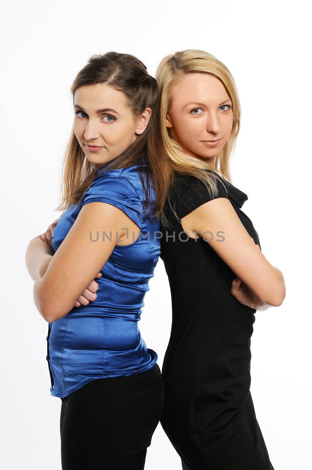 Two young attractive women standing by grauvision