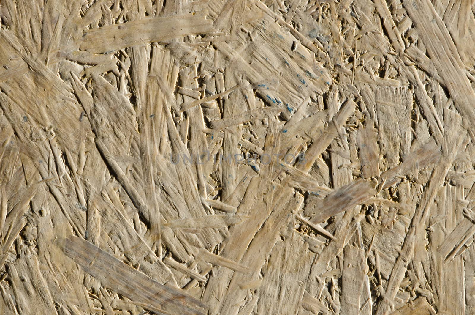 background of chipboard wooden chip plank sheet wall closeup details.