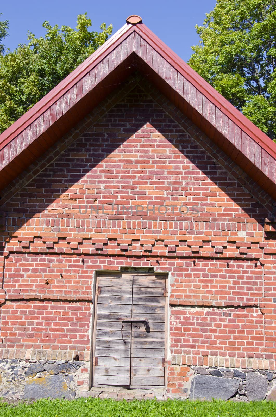 Rural farm building of brick wooden doors padlock by sauletas