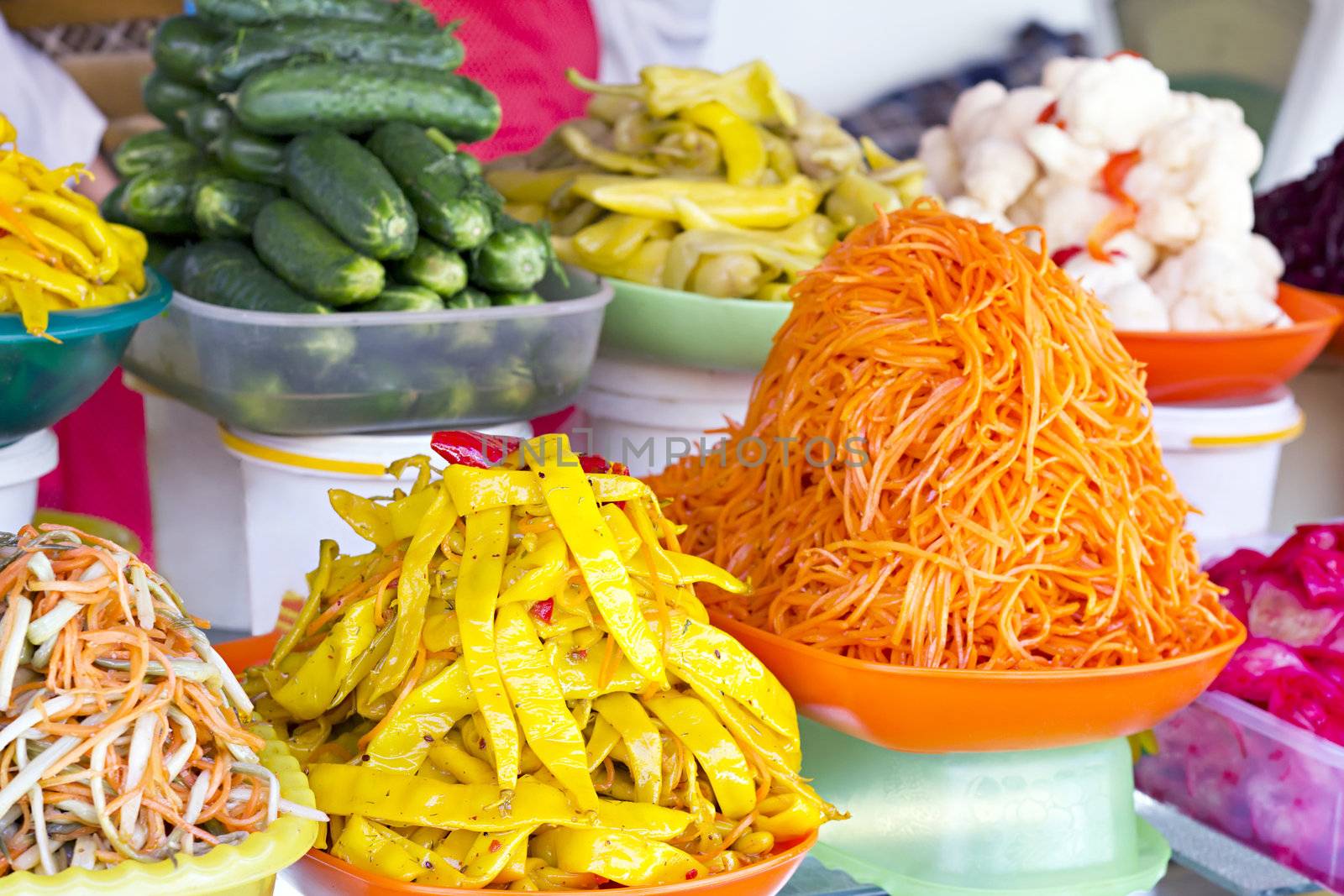 various Korean pickled vegetables in the background