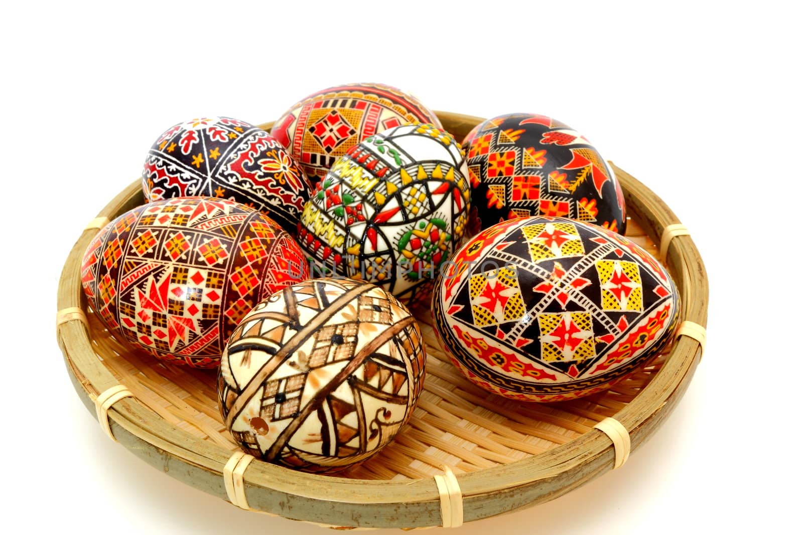 beautiful painted eggs in trellis basket