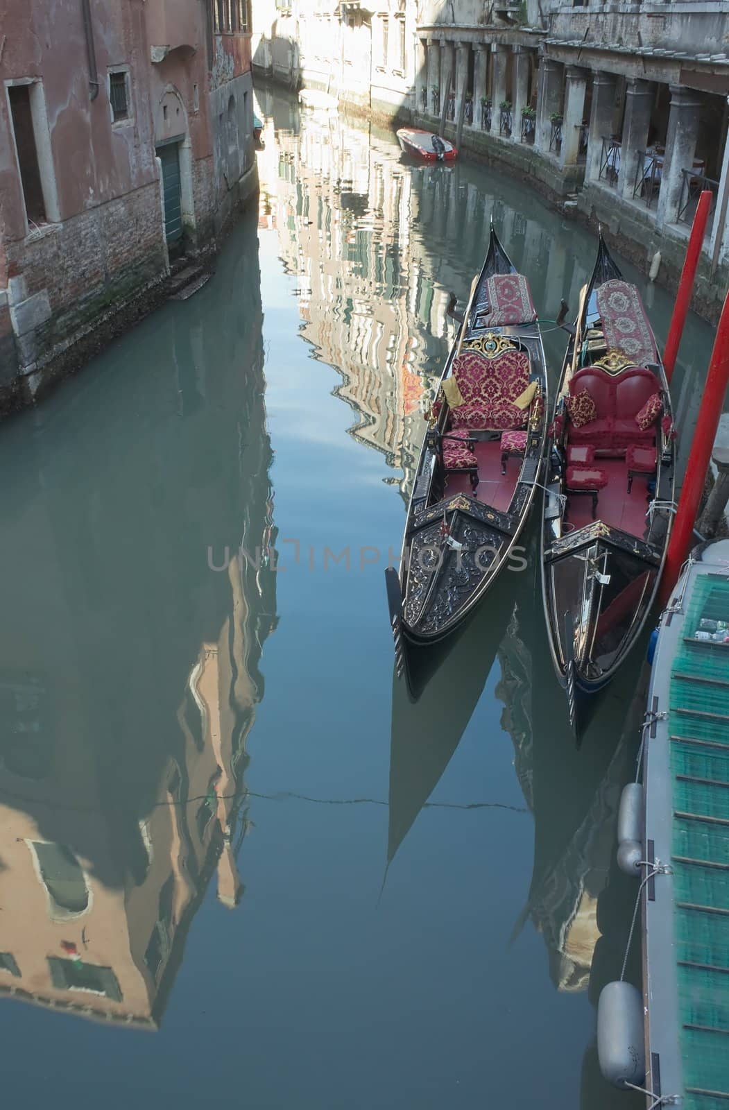 View of Venice. Reflections in the canal and two gondolas.