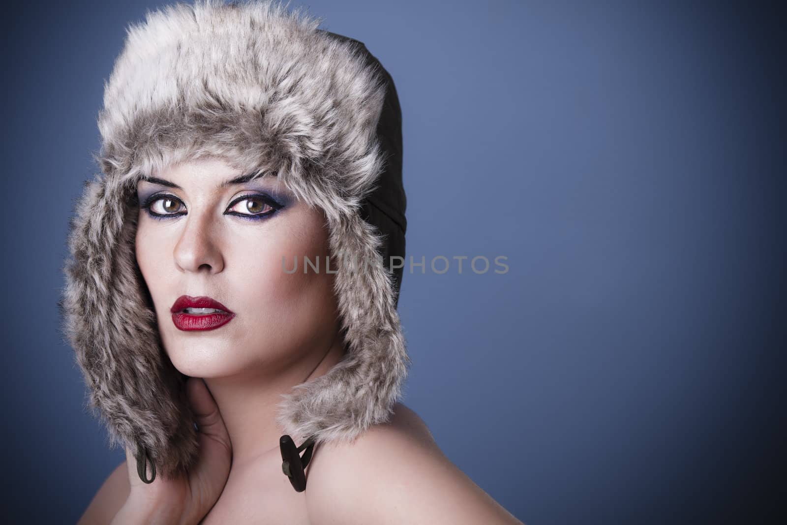 a beauty brunette girl with snow hat