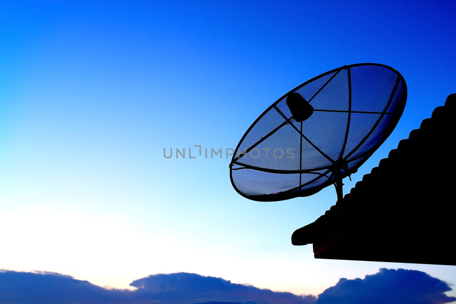 Satellite TV with sunset sky