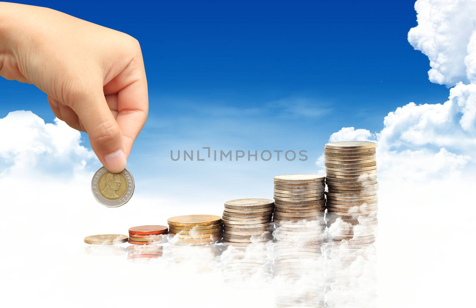 Invest. Conceptual image.  and lot of coins over blue sky backgr by rufous
