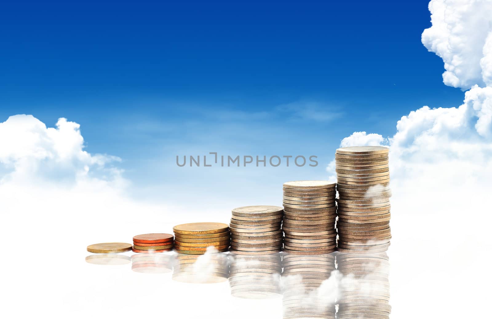 Invest. Conceptual image.  and lot of coins over blue sky background