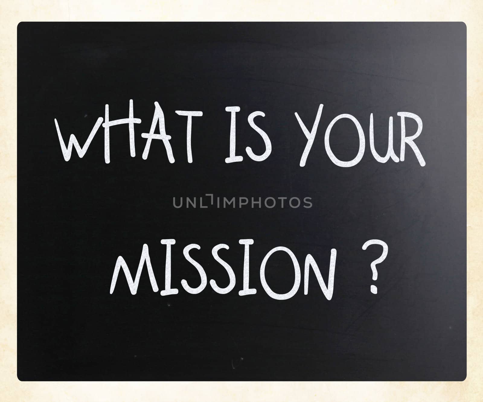 "What is your mission " handwritten with white chalk on a blackboard