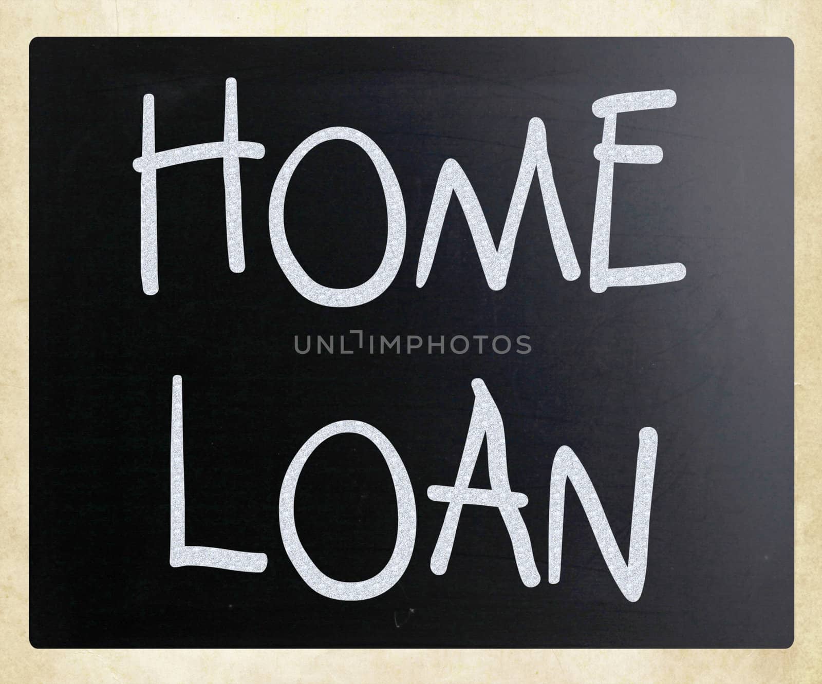 "Home loan" handwritten with white chalk on a blackboard