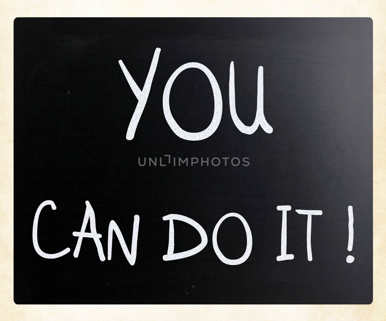 "You can do it" handwritten with white chalk on a blackboard