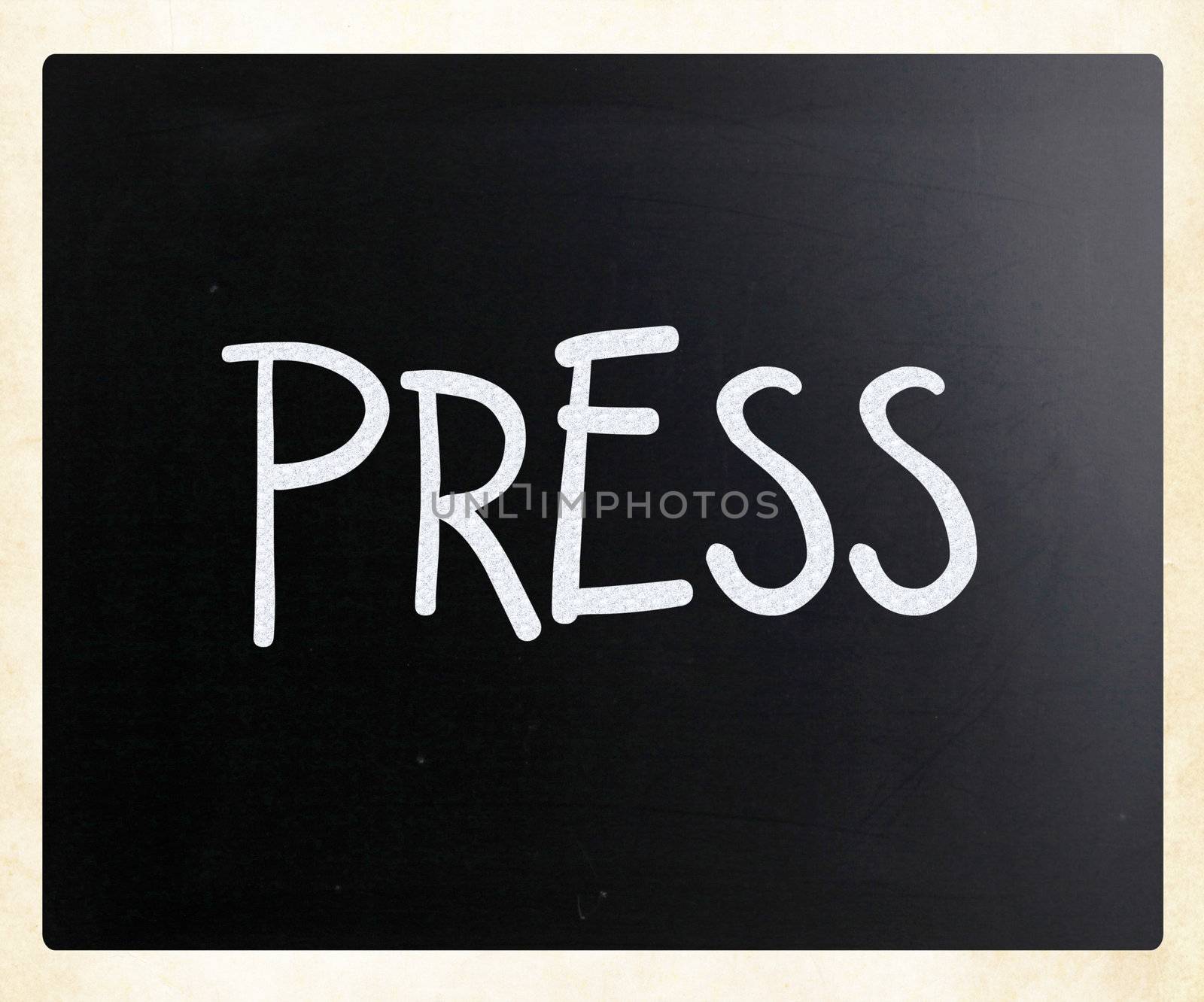 "PRESS" handwritten with white chalk on a blackboard