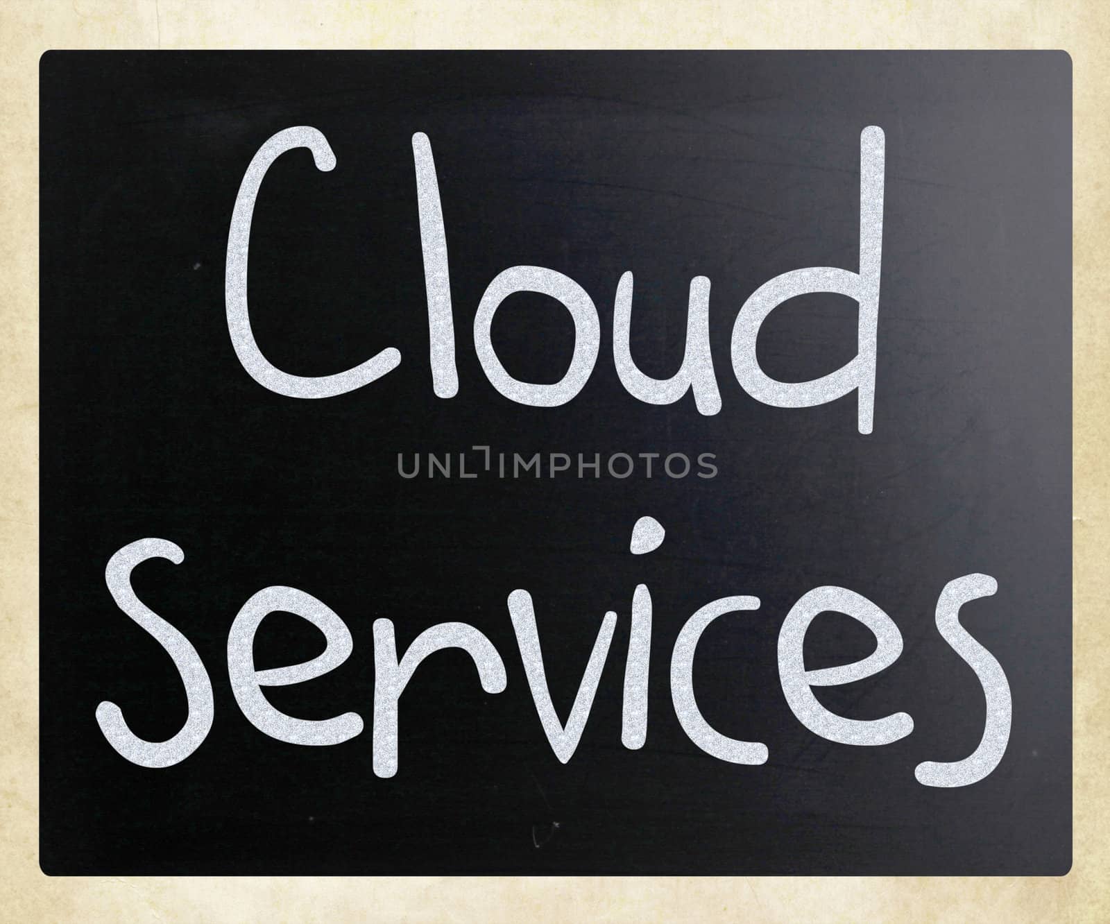 "Cloud services" handwritten with white chalk on a blackboard