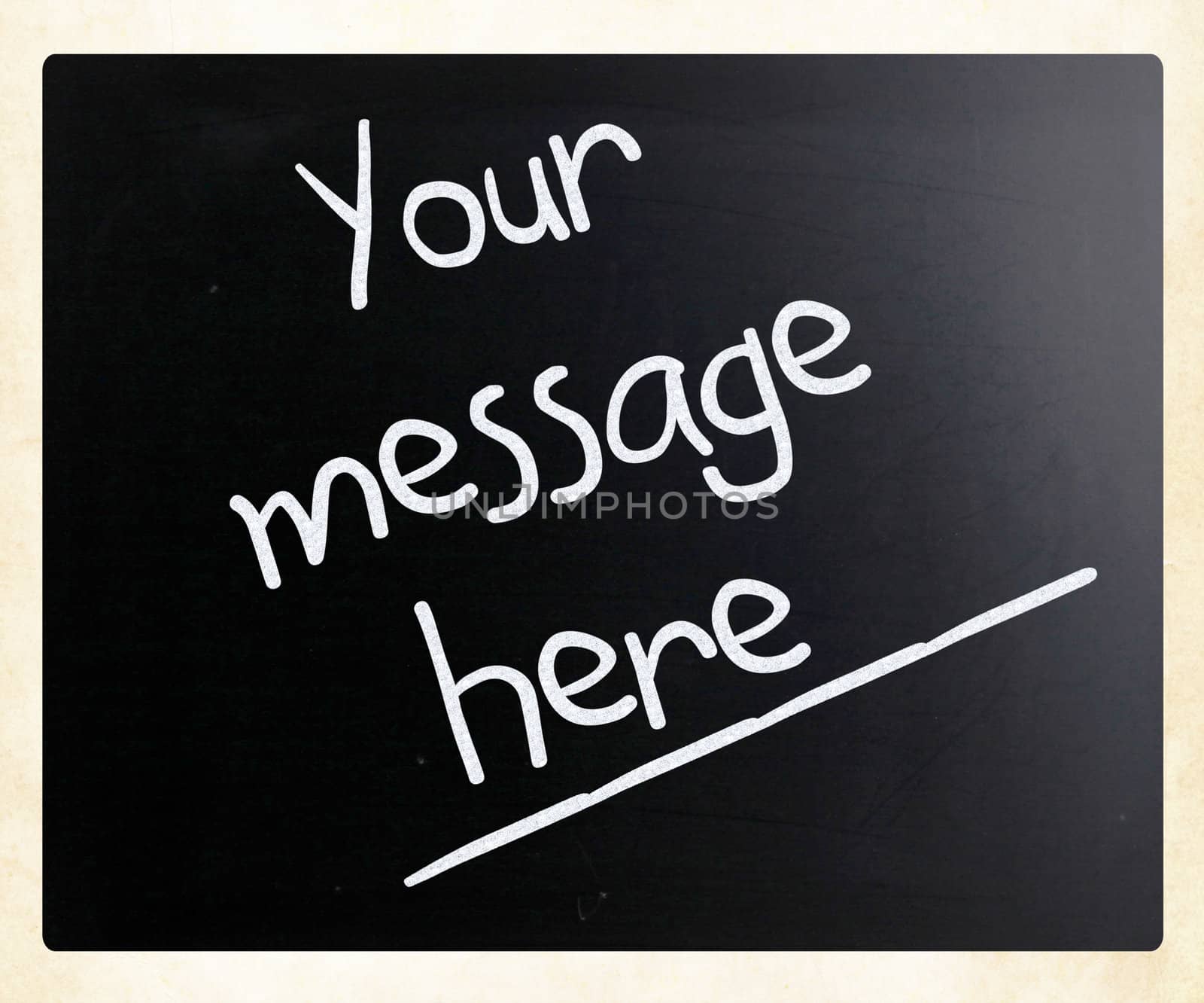 "Your message here" handwritten with white chalk on a blackboard