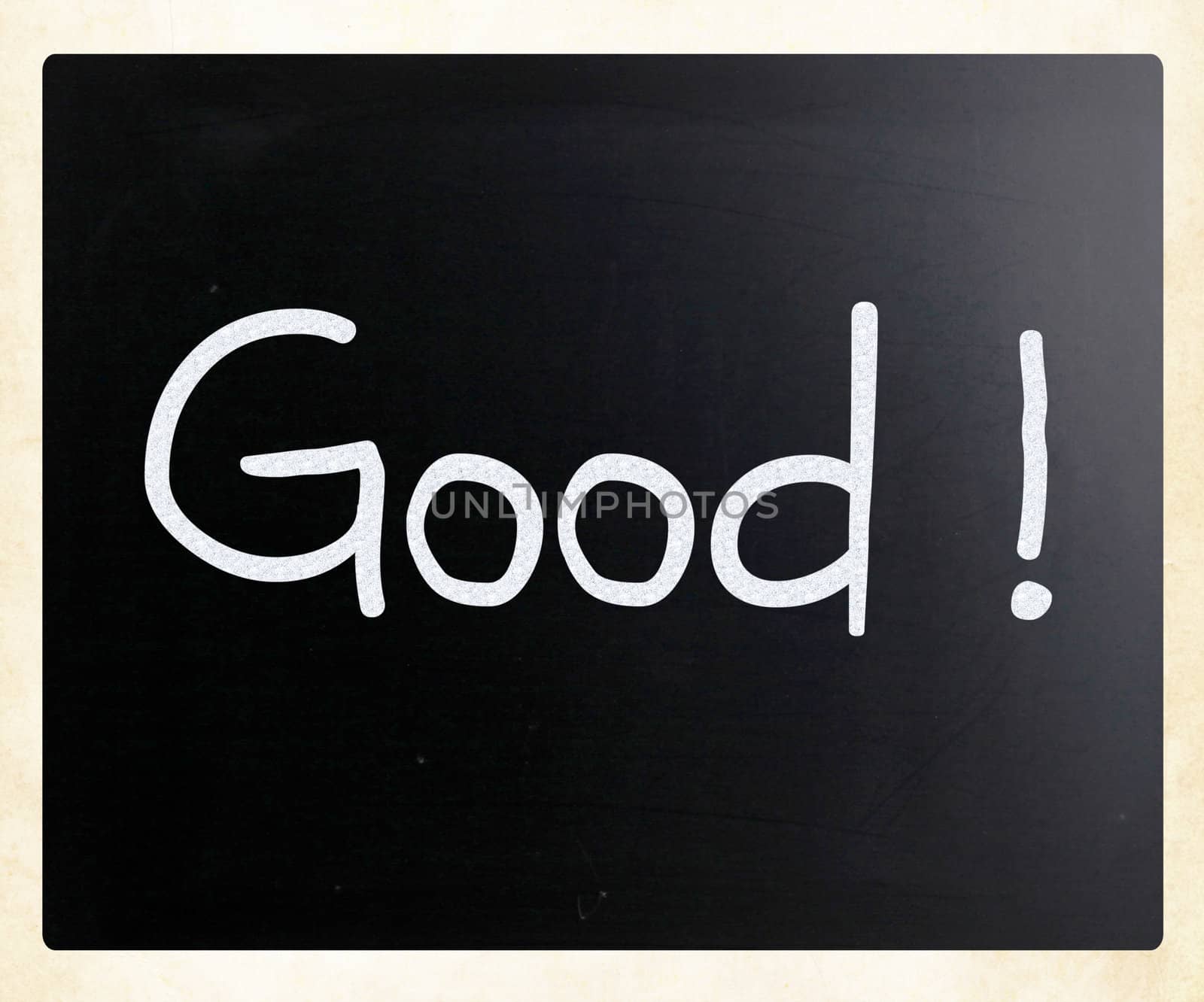 "Good" handwritten with white chalk on a blackboard