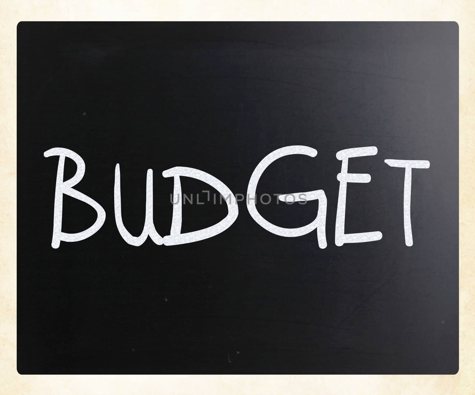 "Budget" handwritten with white chalk on a blackboard