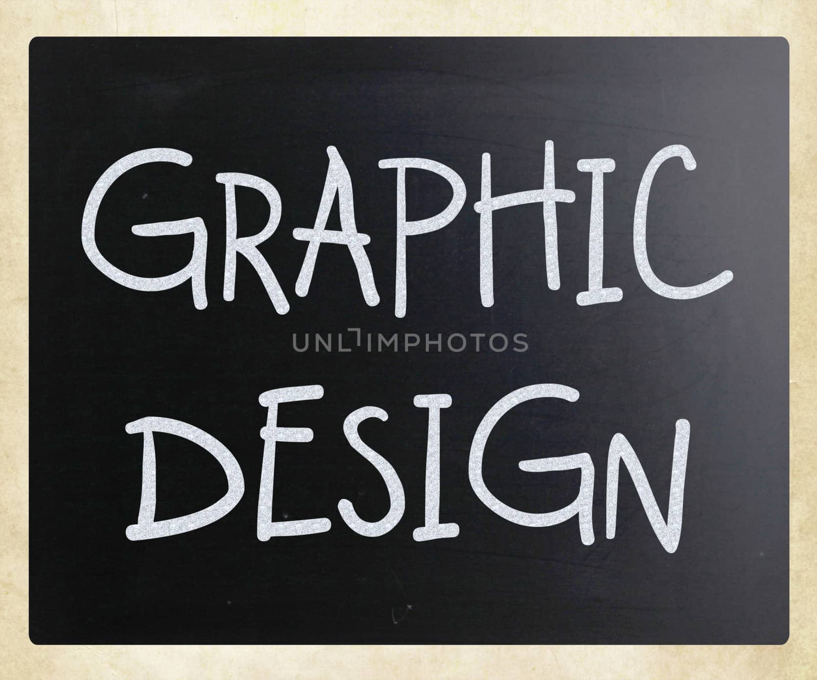 "Graphic design" handwritten with white chalk on a blackboard
