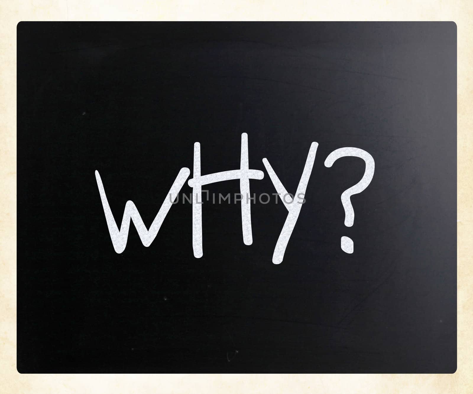 "Why" handwritten with white chalk on a blackboard