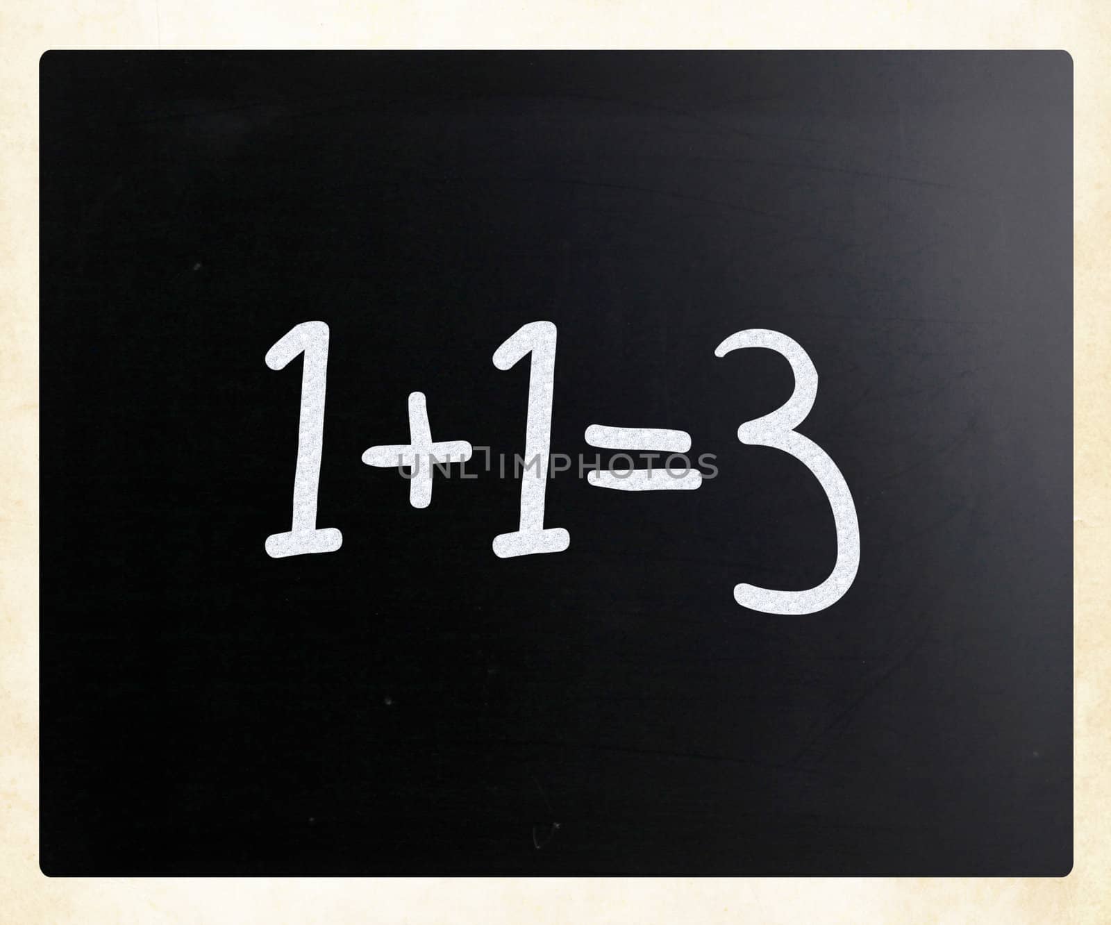 "1+1=3" handwritten with white chalk on a blackboard