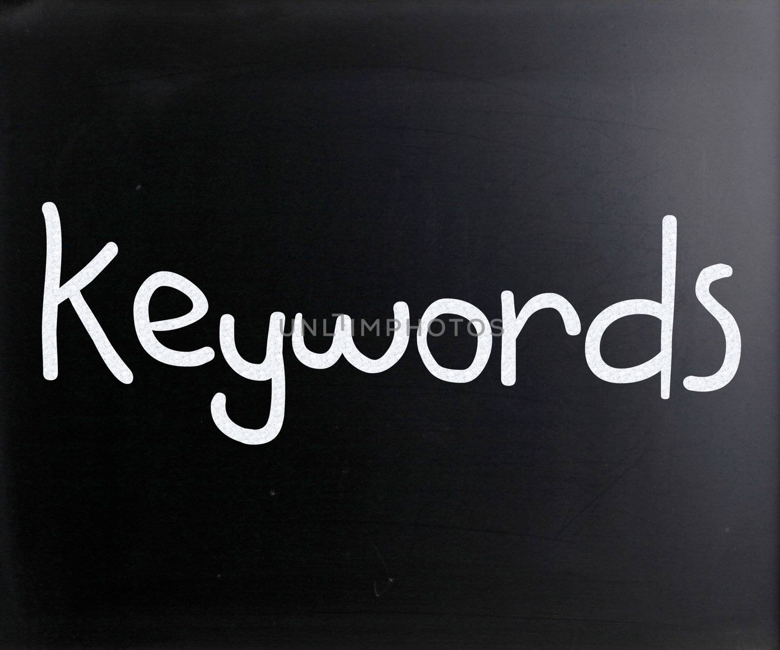 The word "Keywords" handwritten with white chalk on a blackboard