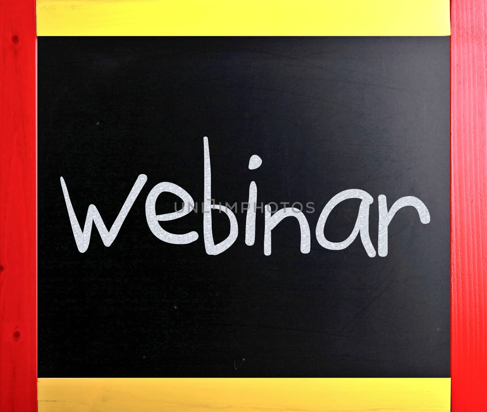 The word "Webinar" handwritten with white chalk on a blackboard